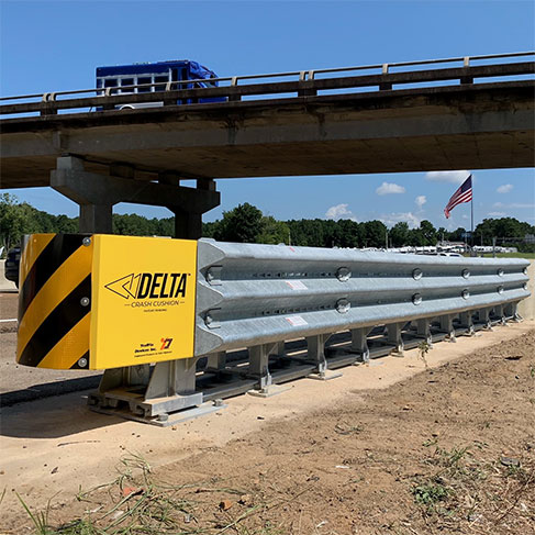 Delta TL-3 Crash Cushion installed on a highway cement barrier