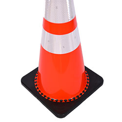 A close up view of a 28" TrafFix PVC Cone with one (1) 6" and one (1) 4" reflective collars highlighting the sheeting and the weighted base (#15028-HIWB-C7).